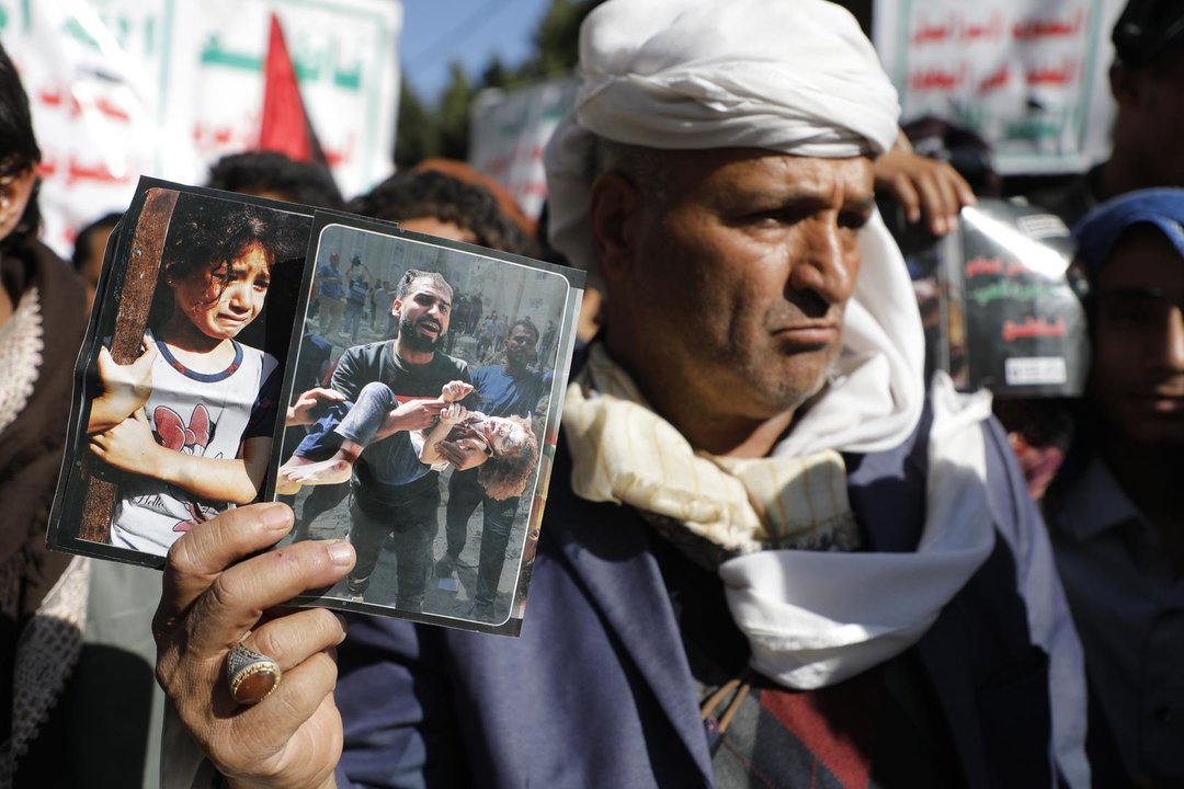 December 8, 2023, SANAA, Sanaa, Yemen: A protester holds photographs from Gaza, during a demonstration in solidarity with Palestinians in the Gaza, amid the ongoing conflict between Israel and the Palestine..The United States imposed sanctions on Thursday on 13 individuals and entities for allegedly funneling tens of millions of dollars in foreign currency to Yemen's Houthi group from the sale and shipment of Iranian commodities..The Houthis say they have been staging drone and missile attacks against Israel and Israeli ships in the Red Sea in response to the offensive Israel launched against Gaza.,Image: 827899433, License: Rights-managed, Restrictions: , Model Release: no, Credit line: Osamah Yahya / Zuma Press / ContactoPhoto