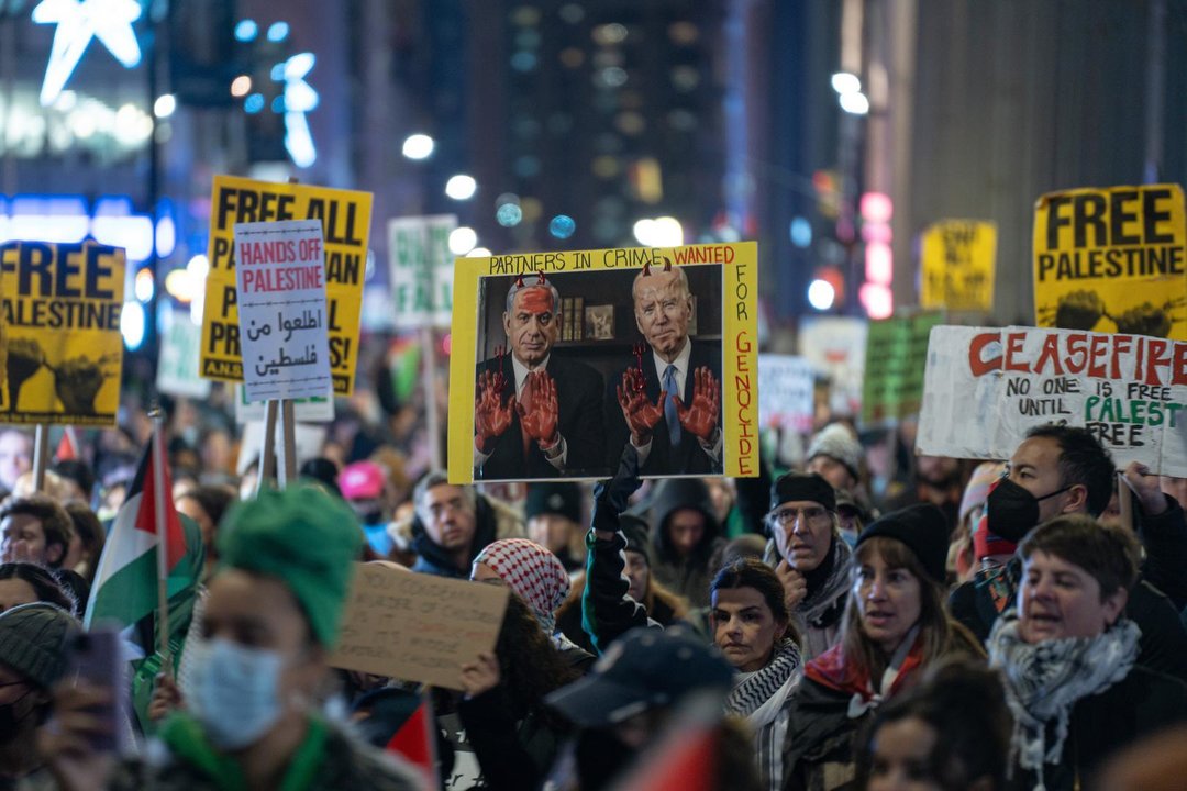 December 8, 2023, New York, NY, United States: A sign with Israel's Prime Minister Benjamin Netanyahu and United States President Joe Biden with red hands and red horns, reading ''Partners In Crime. Wanted for Genocide''. Pro-Palestine demonstrators march in protest of the US and US operated companies for their support of Israel during the Israel/Palestine conflict. The demonstration continued past Wall Stret after word of the US vetoing the UN Security Council's draft resolution that calls for an immediate ceasefire reached organizers.,Image: 828243732, License: Rights-managed, Restrictions: , Model Release: no, Credit line: Derek French / Zuma Press / ContactoPhoto