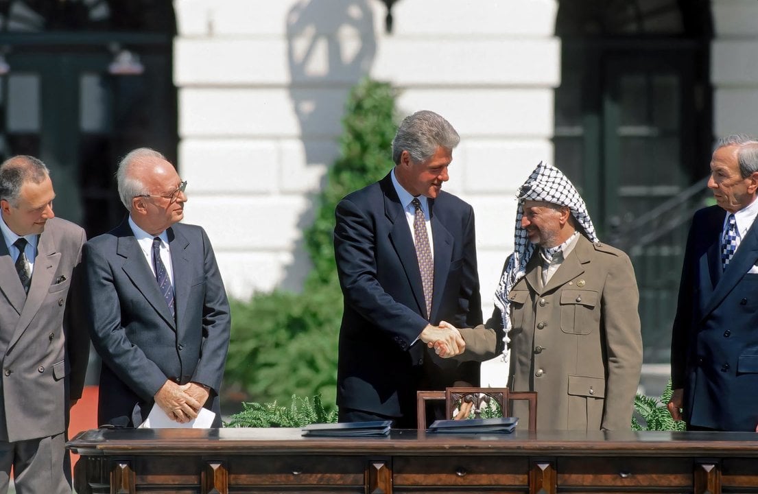 September 13, 1993, Washington, District of Columbia, US: United States President William Jefferson Clinton shakes hands with PLO Chairman Yasser Arafat while United States Secretary of State Warren Christopher (R) and Russian Foreign Minister Andrei Kozyrev and Israeli Prime Minister Yitzhak Rabin (L) look on. The political leaders had gathered on the South Lawn of the White House for the signing of the Middle East Peace Accords between Israel and the PLO.,Image: 780842008, License: Rights-managed, Restrictions: , Model Release: no, Credit line: Mark Reinstein / Zuma Press / ContactoPhoto