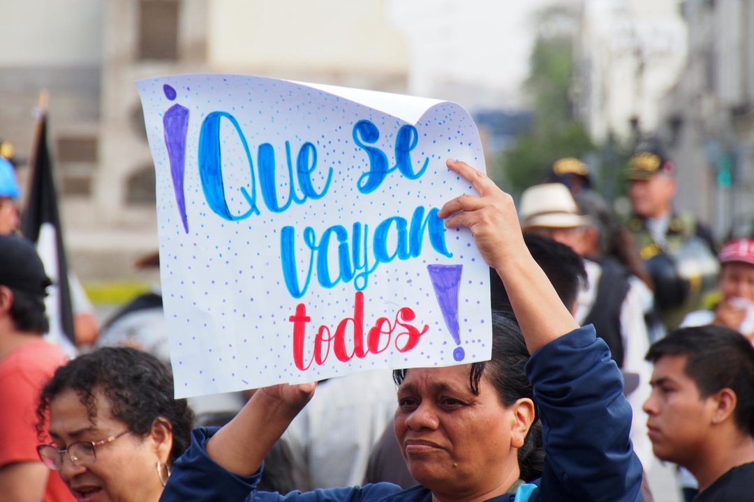 December 7, 2023, Lima, Lima, Peru: ''Get all them out'' can be read on a sign when at the end of Dina Boluarte's first year as president of Peru after the dismissal of Pedro Castillo, hundreds of protesters from social and political organizations, under the slogan "Get them all out", took to Lima streets to demand the suspension and trial of the Attorney General, the closure of Congress and new general elections amid generalized corruption crisis.,Image: 827725729, License: Rights-managed, Restrictions: , Model Release: no, Credit line: Carlos Garcia Granthon / Zuma Press / ContactoPhoto