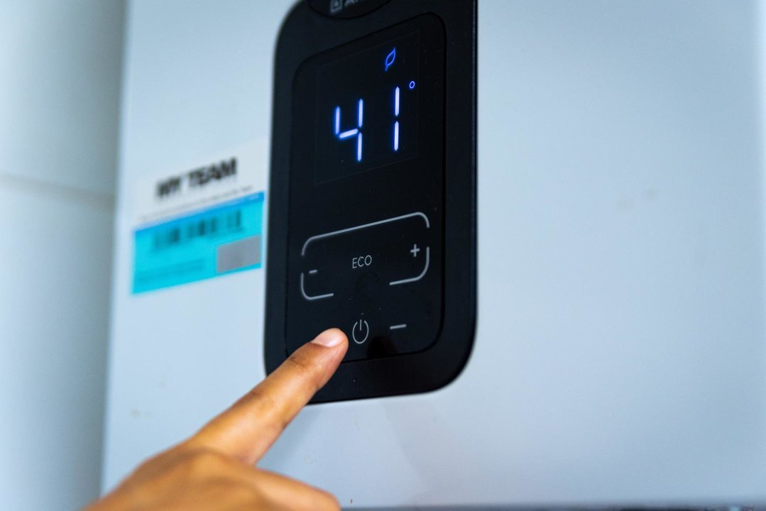 November 20, 2022, Barcelona, Spain: A woman's hand is seen setting the temperature of a home water heater during winter in the Guinardo neighborhood. The increasing cost of natural gas following the Russia-Ukraine war has caused a surge of home heating prices, forcing governments in Europe and globally to provide economic support to lower incomes households.,Image: 738945579, License: Rights-managed, Restrictions: , Model Release: no, Credit line: Davide Bonaldo / Zuma Press / ContactoPhoto