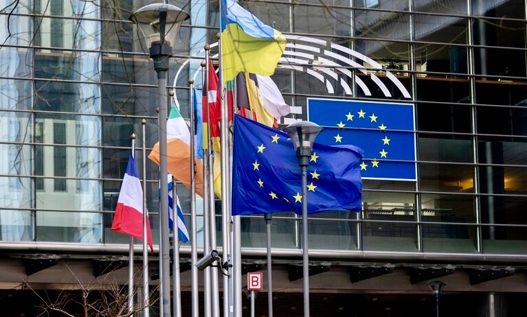 EU flags at half mast at the EP building in Brussels following the death of Jacques Delors, former President of the European Commission