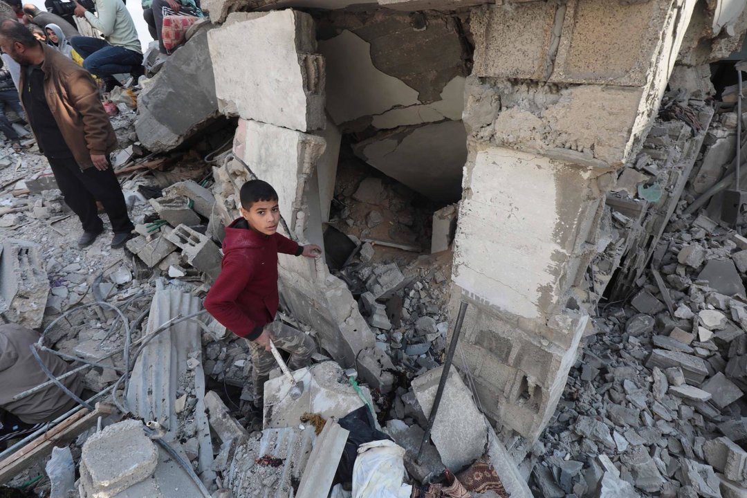 January 25, 2024, Nusairat, Gaza Strip, Palestinian Territory: Palestinians inspect destruction after an Israeli bombing of building  in Nusairat, Gaza on January 25, 2024. Several buildings were collapsed or heavily damaged after the attack. Abed R,Image: 840516155, License: Rights-managed, Restrictions: , Model Release: no, Credit line: Naaman Omar / Zuma Press / ContactoPhoto