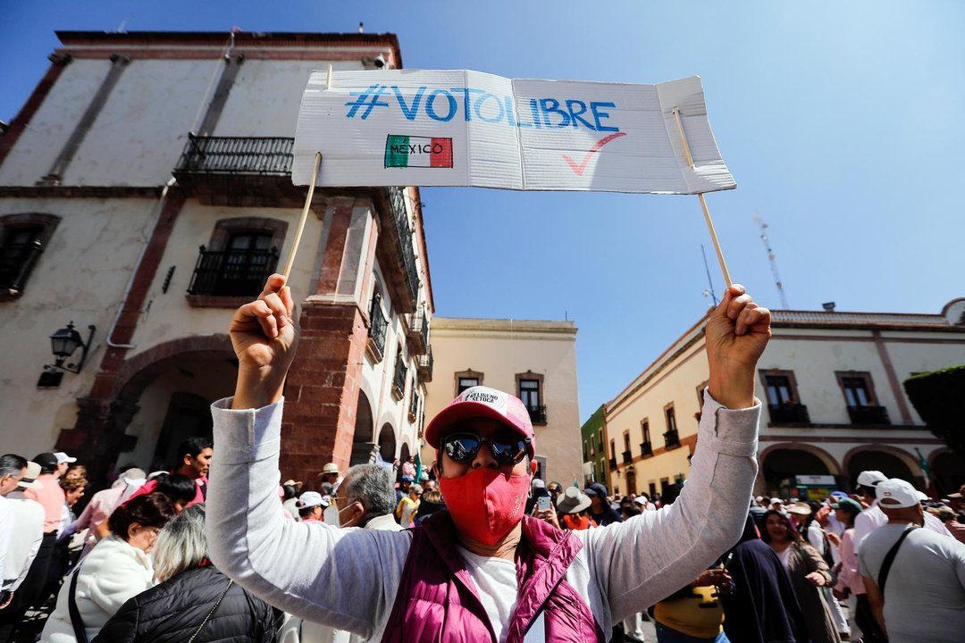 February 18, 2024, Queretaro, Mexico: A protester holds a placard during a March in Defense of Democracy. With a call to defend democracy and institutions, Querétaro joined the 'March for our democracy', a citizen mobilization that takes place simultaneously in several cities in the country.,Image: 848210815, License: Rights-managed, Restrictions: , Model Release: no, Credit line: Cesar Gomez / Zuma Press / ContactoPhoto