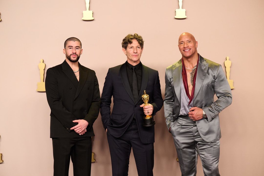 March 10, 2024, Hollywood, California, USA: Presenters Dwayne Johnson and Bad Bunny pose with Jonathan Glazer and his Oscar for International Feature Film during the live ABC telecast of the 96th Oscars at Dolby Theatre at Ovation Hollywood on Sunday, March 10, 2024.,Image: 855737912, License: Rights-managed, Restrictions: , Model Release: no, Credit line: AMPAS / Zuma Press / ContactoPhoto