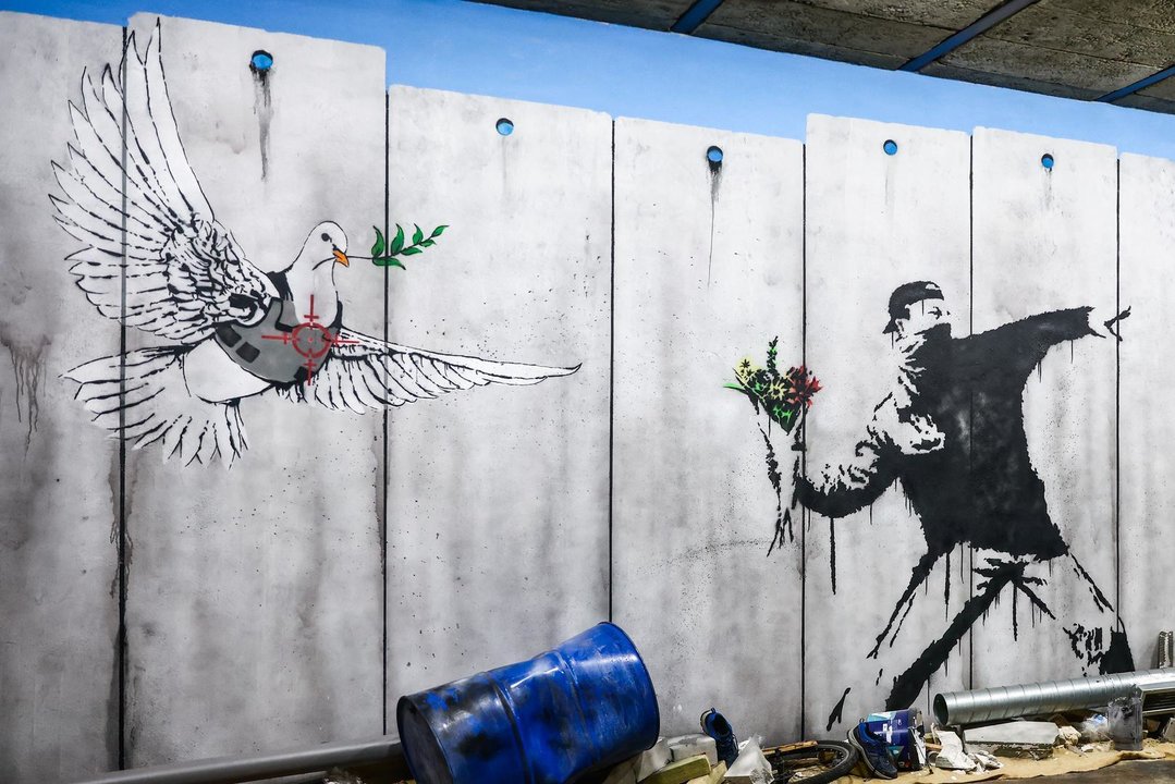 January 20, 2024, Krakow, Poland: Banksy street art graffiti and murals are seen on a reconstruction of the Israeli-Palestinian separation West Bank Wall inside Banksy Museum in Krakow, Poland on January 20th, 2024. An exhibition inspired by Banksy's street art features reproductions of over 150 pieces of the most mysterious contemporary artist which have been organized in area of over a thousand square metres.in post-industrial interiors of old factory.,Image: 840880887, License: Rights-managed, Restrictions: , Model Release: no, Credit line: Beata Zawrzel / Zuma Press / ContactoPhoto
