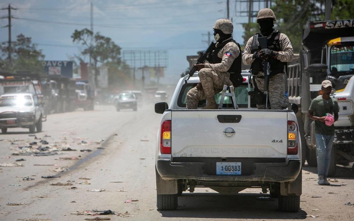 December 26, 2023: In 2022, Haiti police on patrol keep their eyes on traffic during a stop at a police checkpoint in Tabarre, near the U.S. Embassy, east of metropolitan Port-au-Prince. Gangs have taken control of neighborhoods in the vicinity.,Image: 832467632, License: Rights-managed, Restrictions: , Model Release: no, Credit line: JosĂ�Â© A. Iglesias / Zuma Press / ContactoPhoto