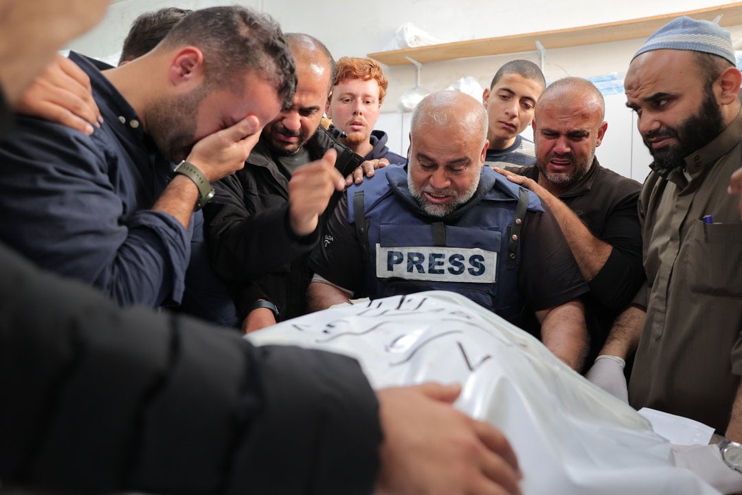 January 7, 2024, Rafah, Gaza Strip, Palestinian Territory: Al Jazeera's bureau chief in Gaza, Wael Al-Dahdouh is comforted during the funeral of his son Hamza Wael Dahdouh, a journalist with the Al Jazeera television network, who was killed in a reported Israeli air strike, in Rafah in the Gaza Strip on January 7, 2024. Dahdouh, who was himself wounded in the arm, lost his wife and two other children in Israeli bombardment in the initial weeks of the war,Image: 834921022, License: Rights-managed, Restrictions: , Model Release: no, Credit line: Bashar Taleb / Zuma Press / ContactoPhoto