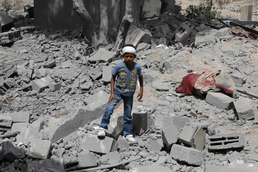 GAZA, May 19, 2024  -- A Palestinian child stands on the rubble after an Israeli airstrike on the Nuseirat refugee camp in the central Gaza Strip, May 19, 2024. At least 31 Palestinians were killed on Sunday in an Israeli airstrike in the central Gaza Strip while the Israeli army announced the killing of two of its soldiers in battles in the enclave.
   Local sources and eyewitnesses told Xinhua that Israeli warplanes targeted at dawn an inhabited house for the Hassan family in the Nuseirat Palestinian refugee camp, which led to its destruction.,Image: 874469355, License: Rights-managed, Restrictions: , Model Release: no, Credit line: Palestinian News Agency / Xinhua News / ContactoPhoto