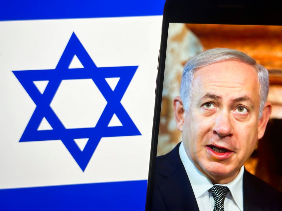 August 6, 2024: A photo illustration depicting a U.S. State Department image (dated June 27, 2016) of Israeli Prime Minister Benjamin Netanyahu in front of the flag of Israel. ..Conflict in the Middle East is on the horizon after Israeli PM Benjamin Netanyahu ordered double assassinations of a Lebanese Hezbollah commander in Beirut and a chief Hamas political leader Ismail Haniyeh in Tehran. Iran has vowed to retaliate, sparking fears of a wider regional war from the Israel-Hamas war in Gaza, with Russian President Vladimir Putin allegedly transferring Isklander missiles to Iran and the Iranian Revolutionary Guard's "Axis of Resistance " proxies preparing for war.,Image: 896633931, License: Rights-managed, Restrictions: , Model Release: no, Credit line: Taidgh Barron / Zuma Press / ContactoPhoto